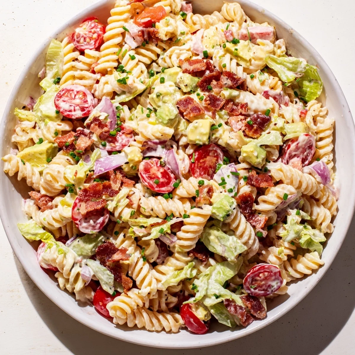 Imagine the vibrant colors of this BLT Pasta Salad with crisp lettuce and tender pasta ready.