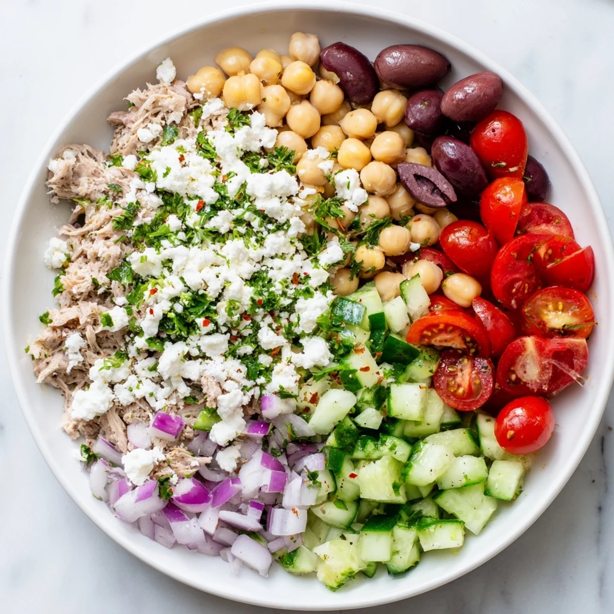 Freshly tossed Tuna Chickpea Salad, showcasing tender tuna chunks and a zesty, flavorful dressing.