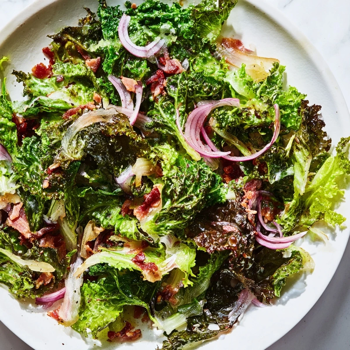 Vibrant Bitter Greens Salad with Warm Bacon Dressing, a delightful, crisp salad ready to serve.