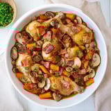 Tender Instant Pot Coq au Vin Style Chicken Thighs, served with a savory, red wine mushroom sauce and bacon.
