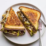 Sizzling skillet showing a crispy Roast Garlic Mushroom & Thyme Grilled Cheese, ready to be devoured with its golden crust.