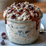 Velvety overnight oats layered with mini chocolate chips and nutty almond butter, inspired by classic cookie dough flavors.