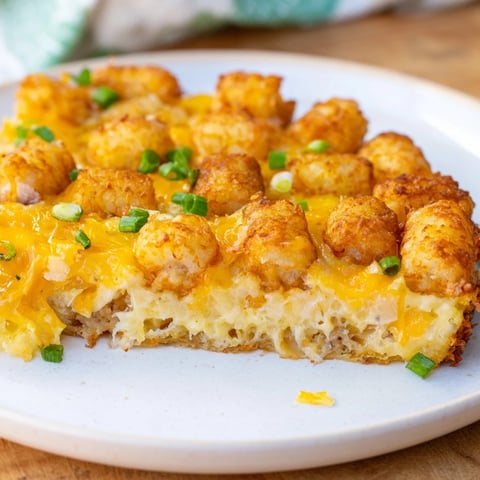 Golden-topped Tater Tot Frittata, bubbly cheese and tender eggs baked with crispy tater tots.