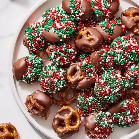 Air Fryer Christmas Pretzel Bites, beautifully arranged, glistening with melted chocolate and festive sprinkles.