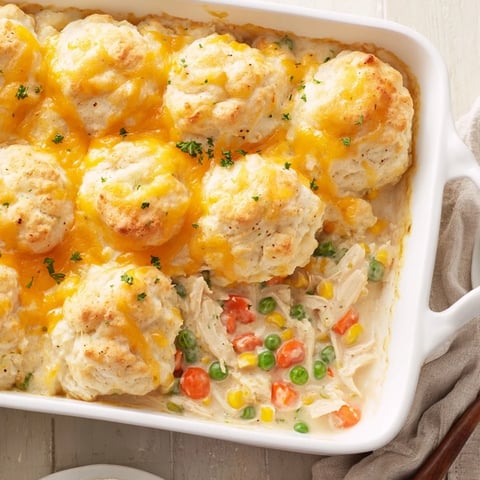 Golden-brown Chicken Cobbler with Red Lobster mix, bubbly filling, and a fluffy, cheesy topping.
