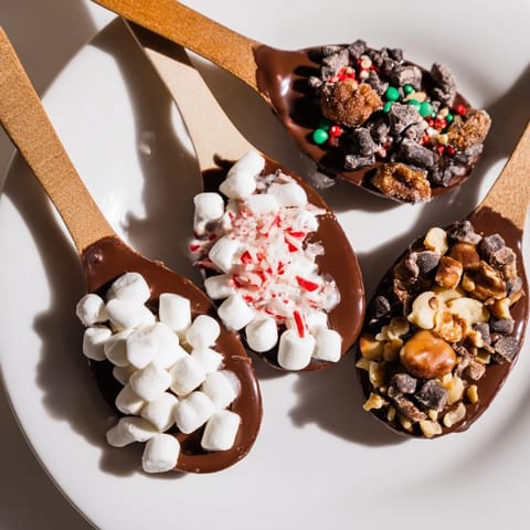 A festive Hot Chocolate Spoon Toppings Board, overflowing with colorful treats for a cozy dessert spread.