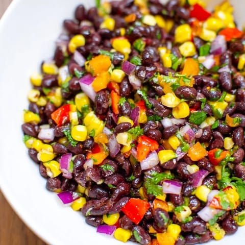Close-up of a refreshing Southwest Black Bean Salad, full of texture and flavor, perfect for a light lunch.