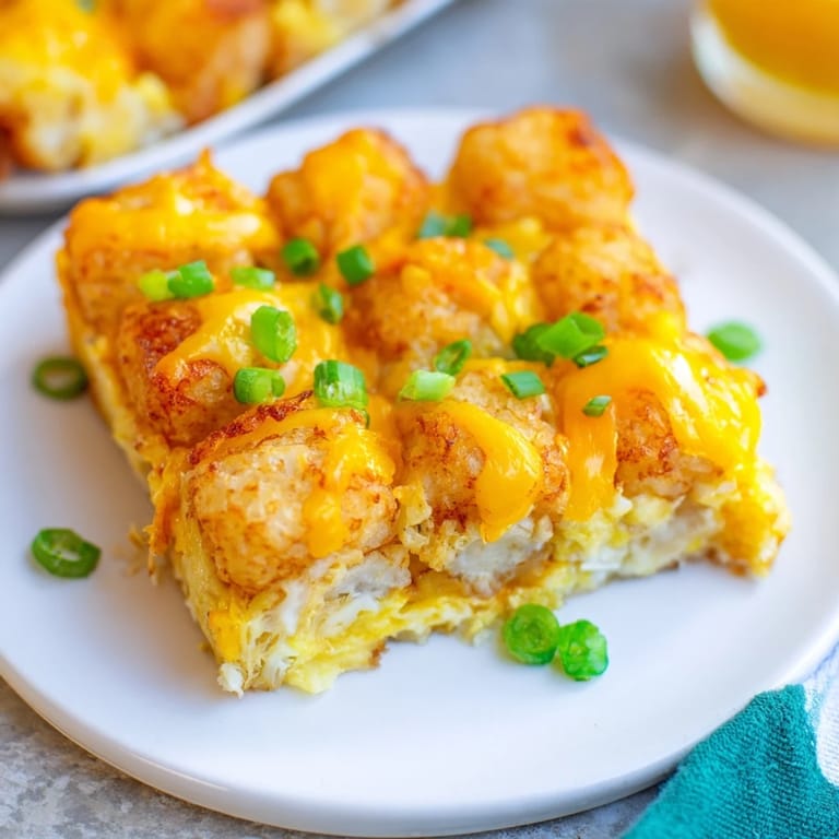 Savory Tater Tot Frittata boasting golden tater tots and a creamy egg filling, ready for dinner.