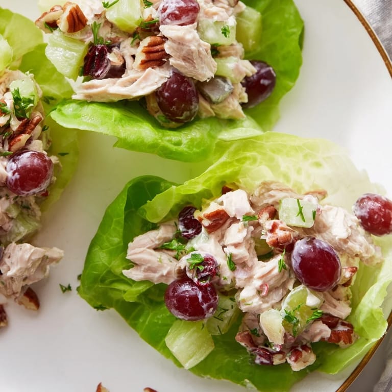 Freshly prepared Simplified Festive Chicken Salad Cups in lettuce cups, ready to serve and enjoy.