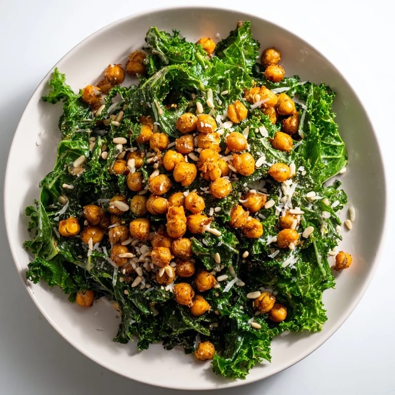 Golden, crispy chickpeas crown this warm kale salad, tossed with a bright lemon dressing.
