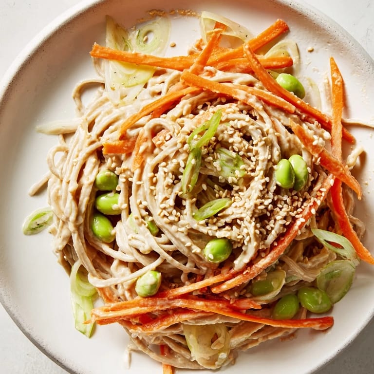 Close-up of Asian Sesame Noodle Salad, a flavorful cold dish with sesame seeds, ready to eat.