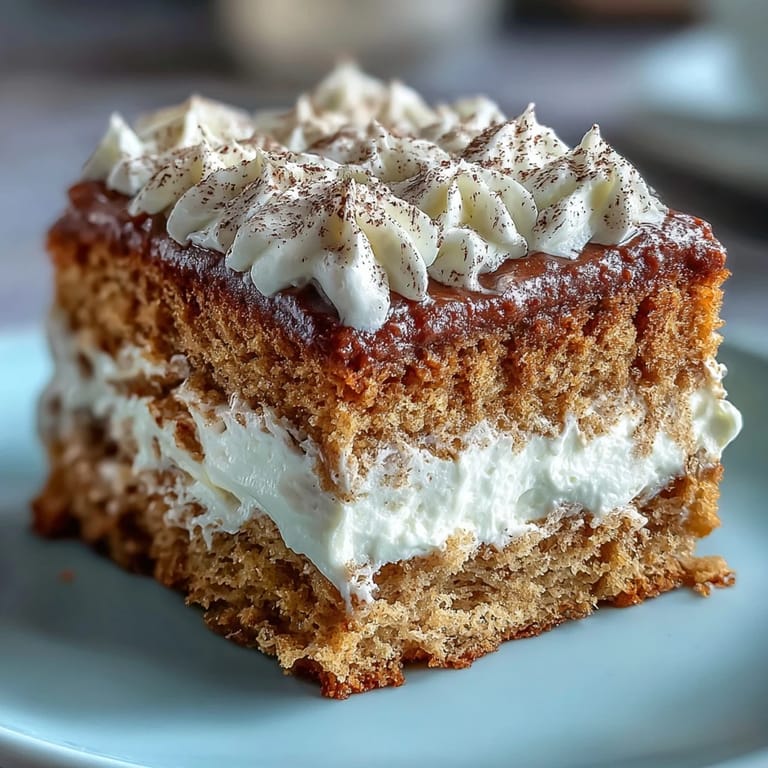 A close-up of Fluffy Hojicha Cake showcases a light, airy crumb, delicately dusted with hojicha powder for a rustic look.