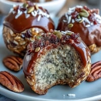 1. Wholesome oat and seed energy balls drizzled with honey, perfect for nut-free snacking on the go.