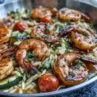 One-Pan Lemon Butter Shrimp and Orzo: A vibrant summer dinner with juicy shrimp, tender orzo, and fresh vegetables in a single skillet.
